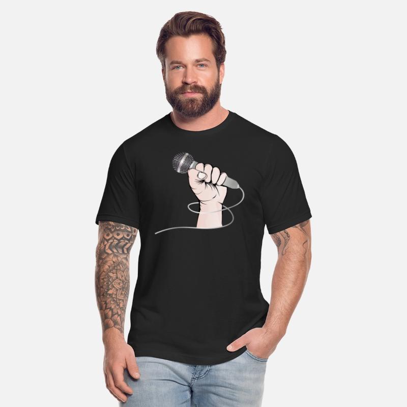 A hand of a singer holds a singing microphone