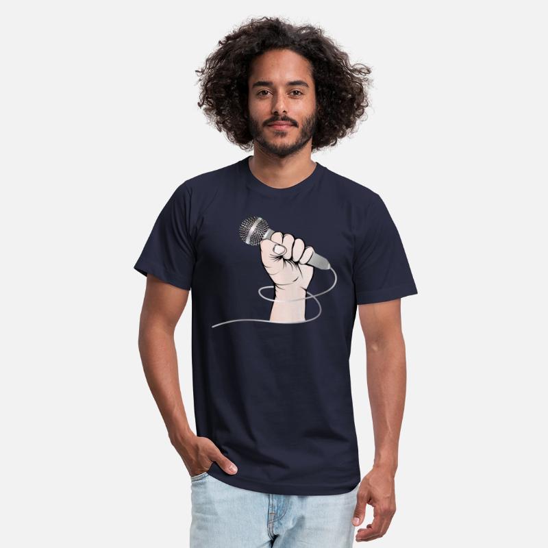 A hand of a singer holds a singing microphone